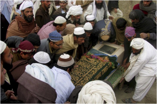 On December 28th 2010 a drone strike killed 2 to 4 civilians in Ghulam Khan, North Waziristan.. 2 were identified as  Jamil and Mustafaa. Above Pakistani villagers look upon the casket of a victim.